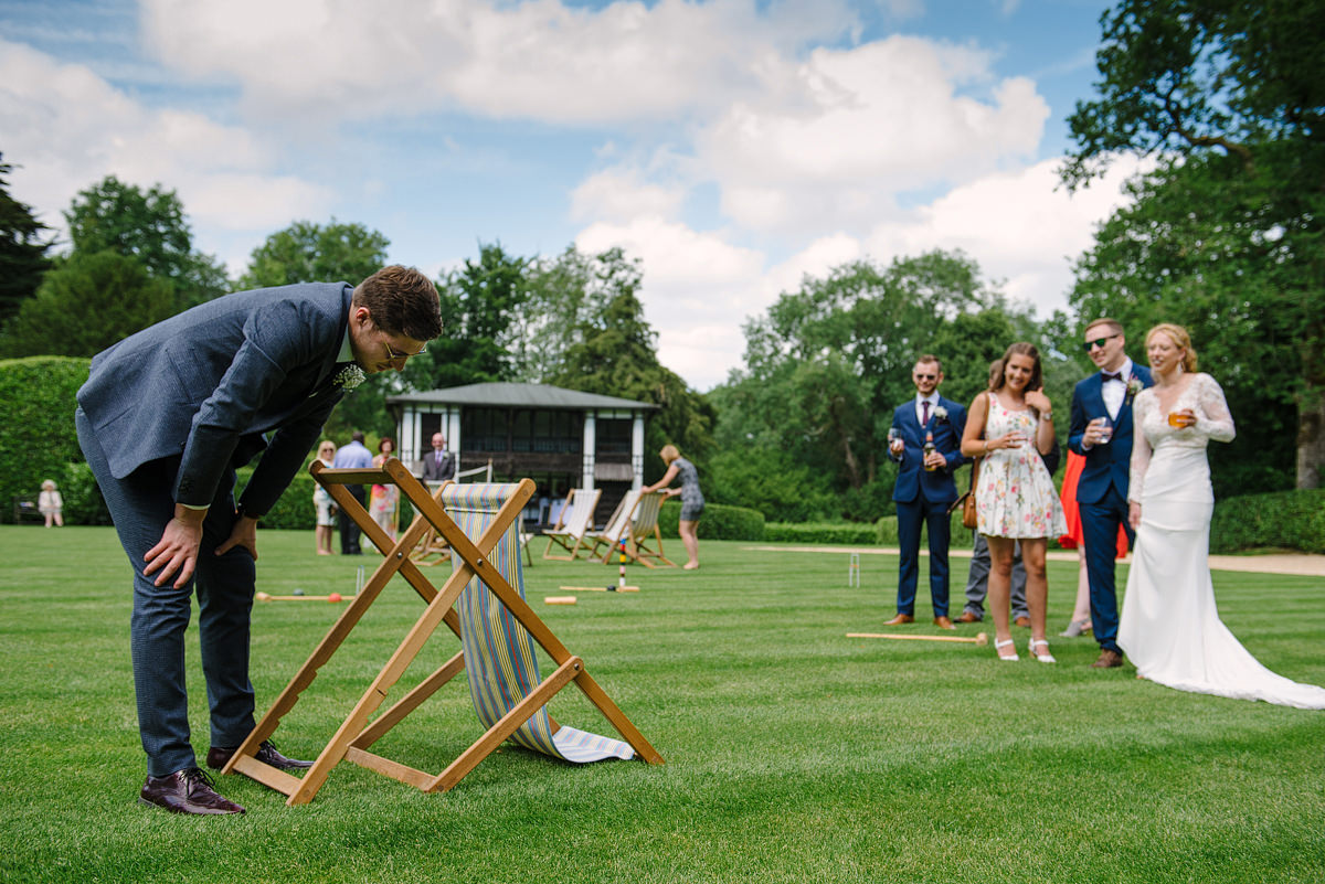 Wedding couple and guest on the lawn at Larmer Tree