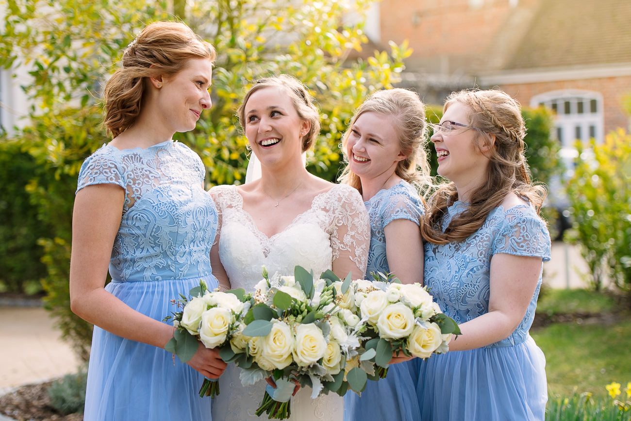 Wedding Photography Bridesmaids having fun - flower bouquets by Fiona Curry at Froyle Park