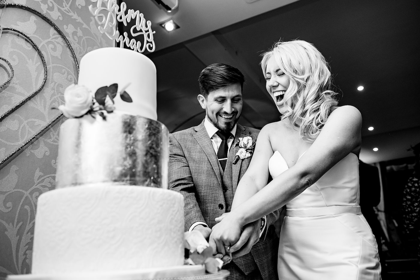 Bride and groom cutting the cake