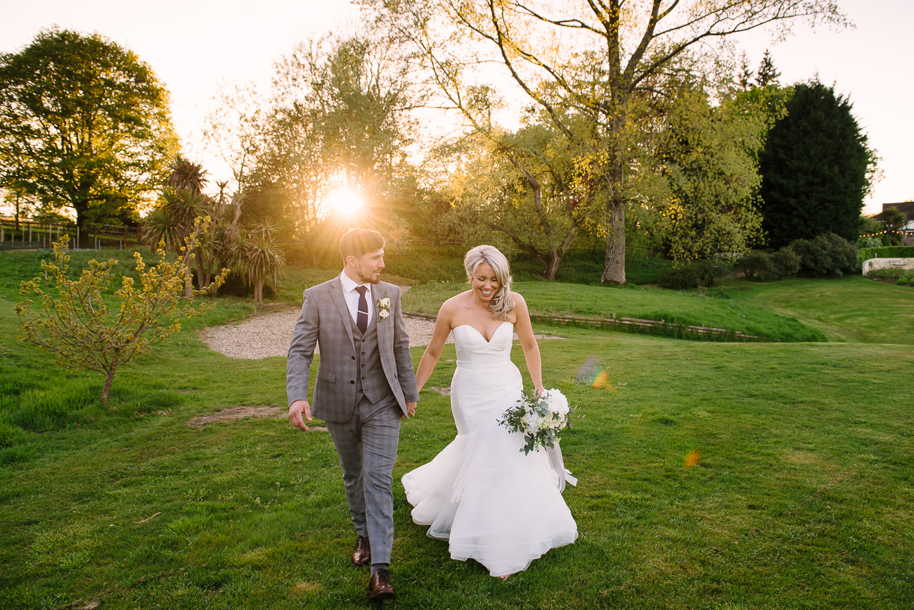 Bride and groom posing in the sunset at Russets Country House 