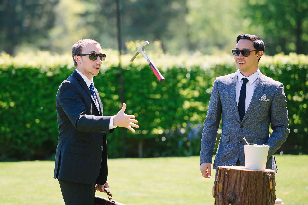 Guy playing stump throwing the hammer 