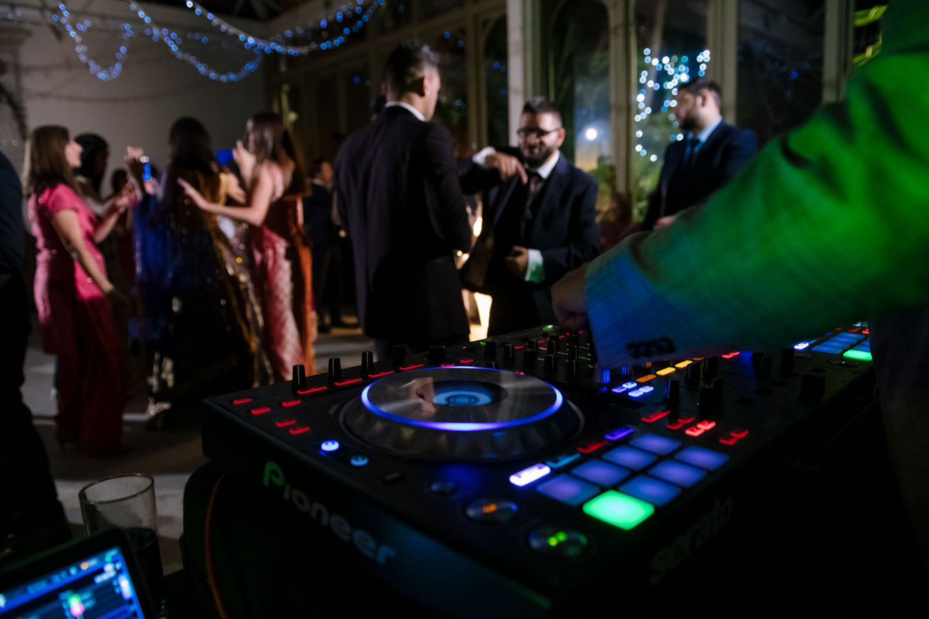 Sikh Asian wedding Dj mixes the music for the party so everyone enjoys himself