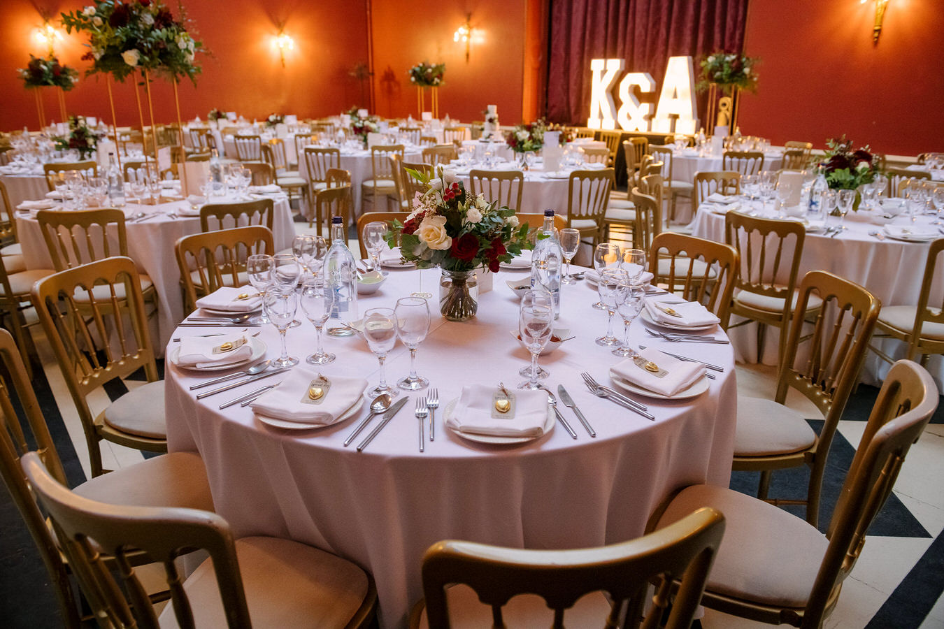 Winter Asian wedding decorations with red and white flowers: red roses, white lisianthus and magenta orchids
