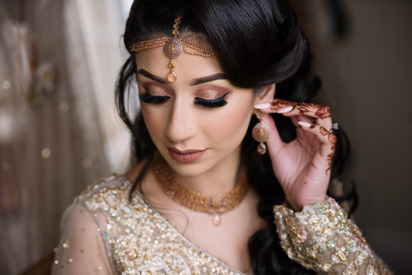Bride maked-up before asian wedding