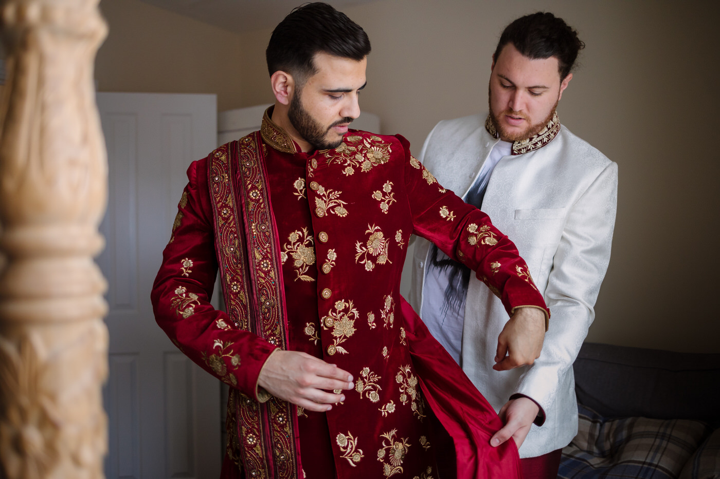 Wedding photography with groom getting dressed for muslim wedding