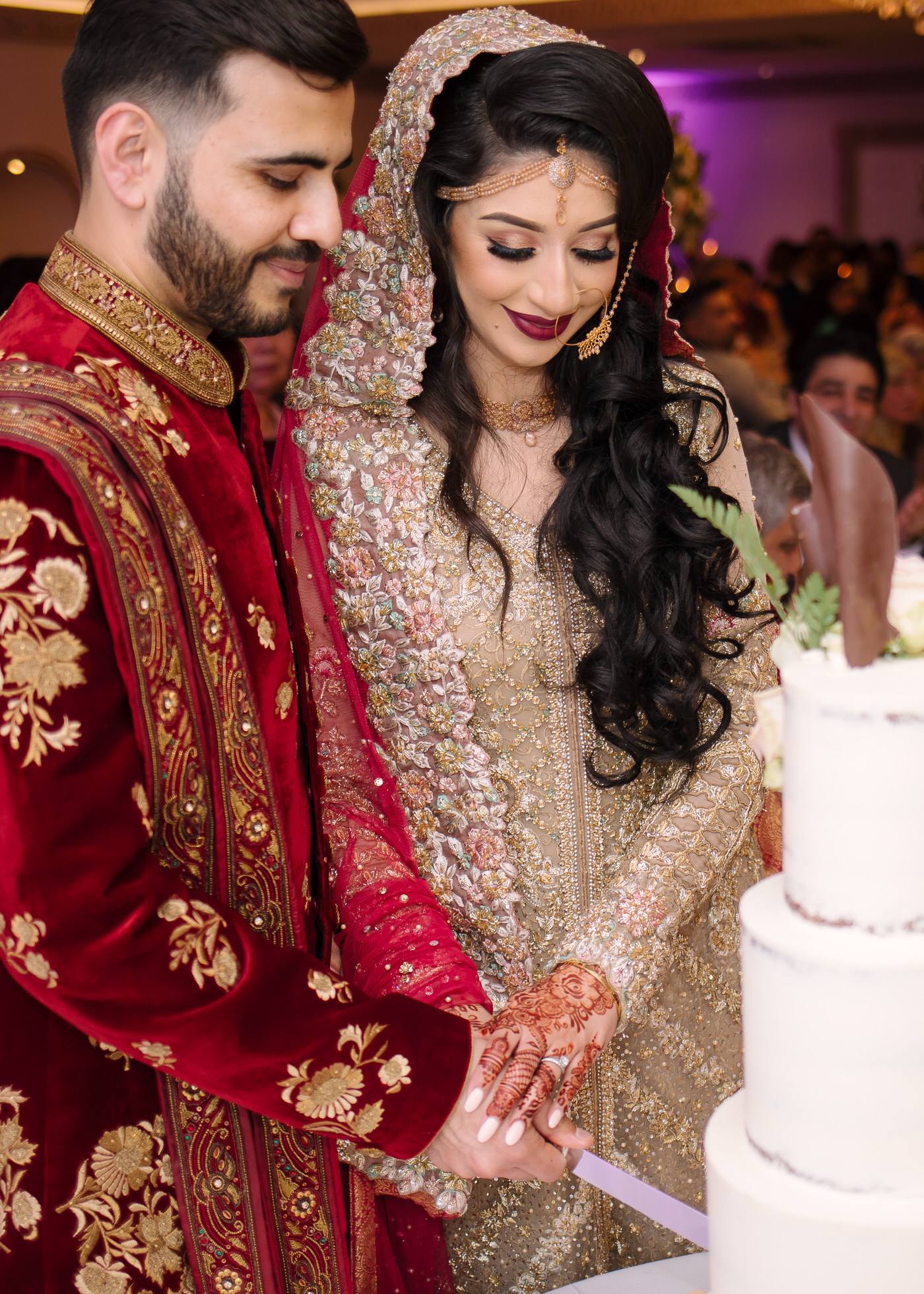 Bride and groom cutting the naked cake at Froyle Park in Surrey