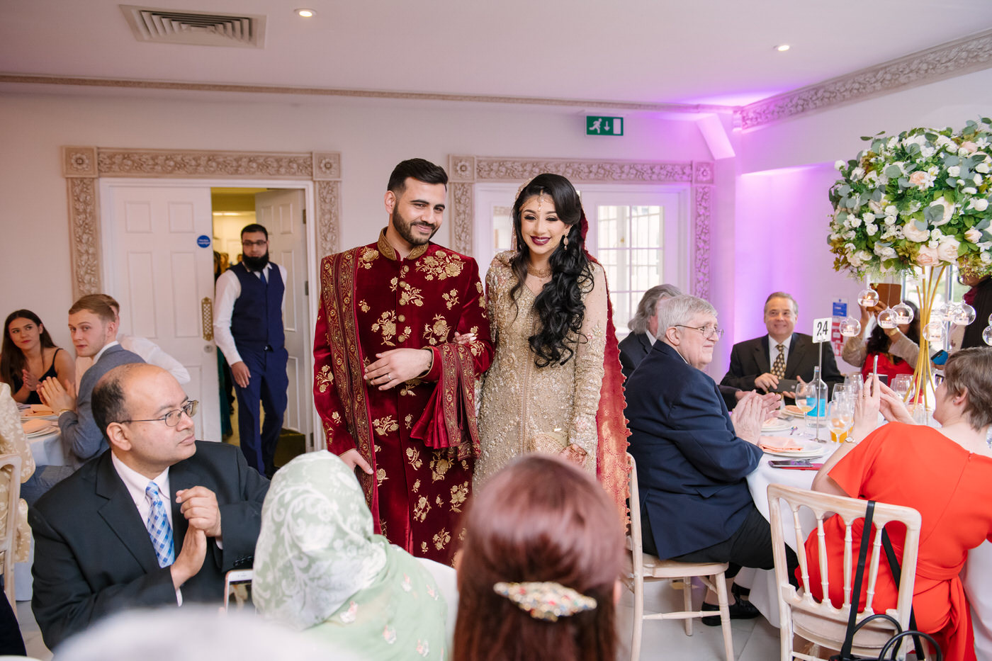 Bride and groom talking with guests at Froyle Park wedding