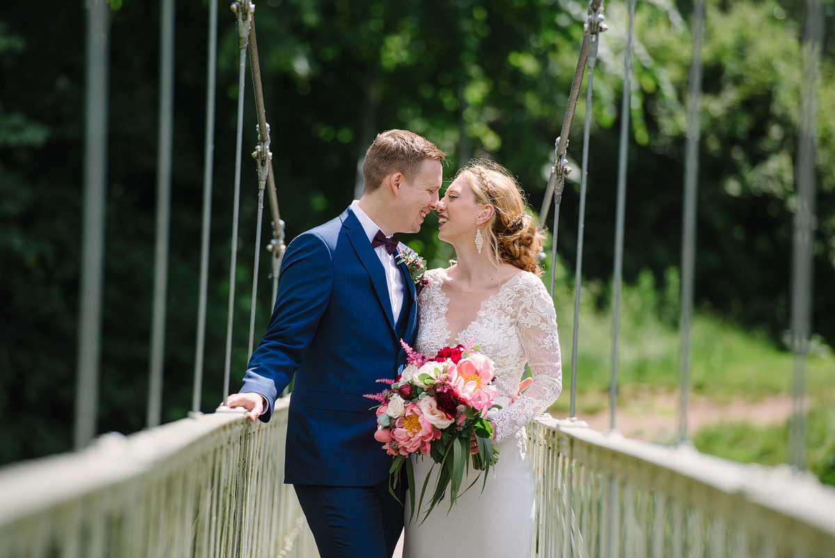 Wedding portraits on the bridge at Canford Parish Church