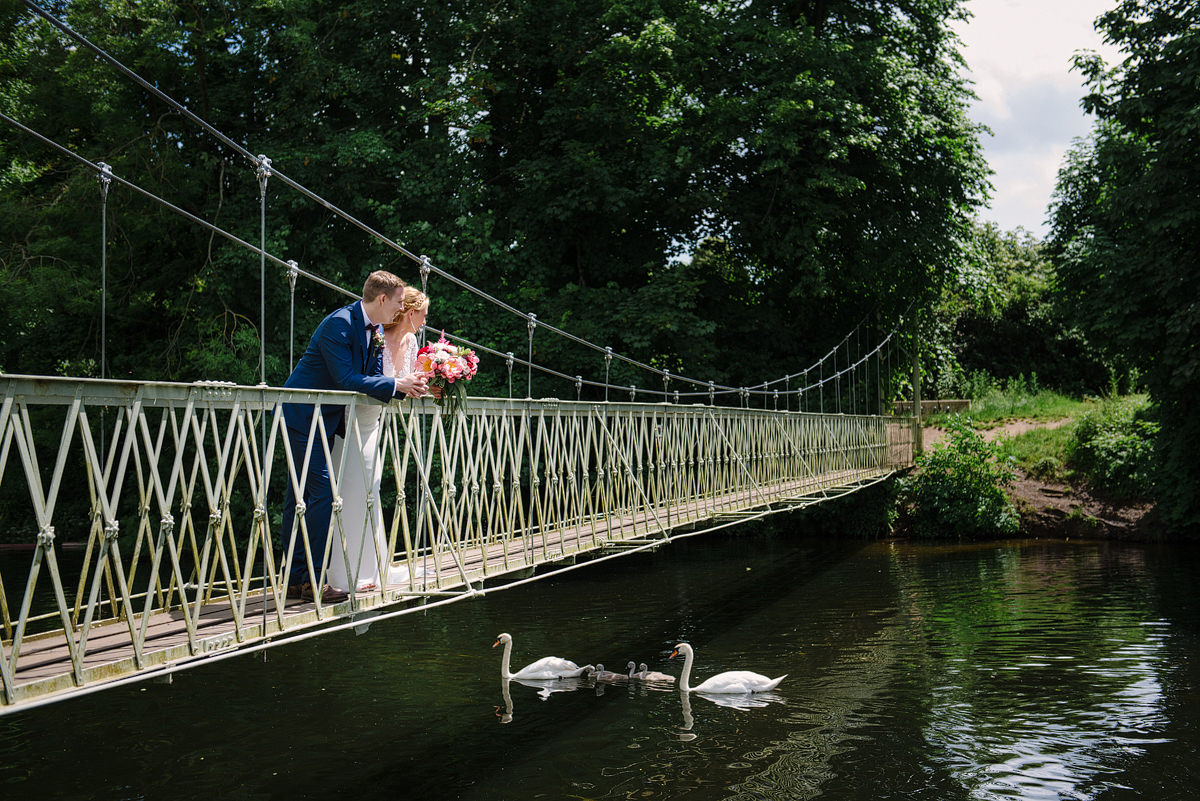 Wedding portrait on the bridge at Canford Parish Church