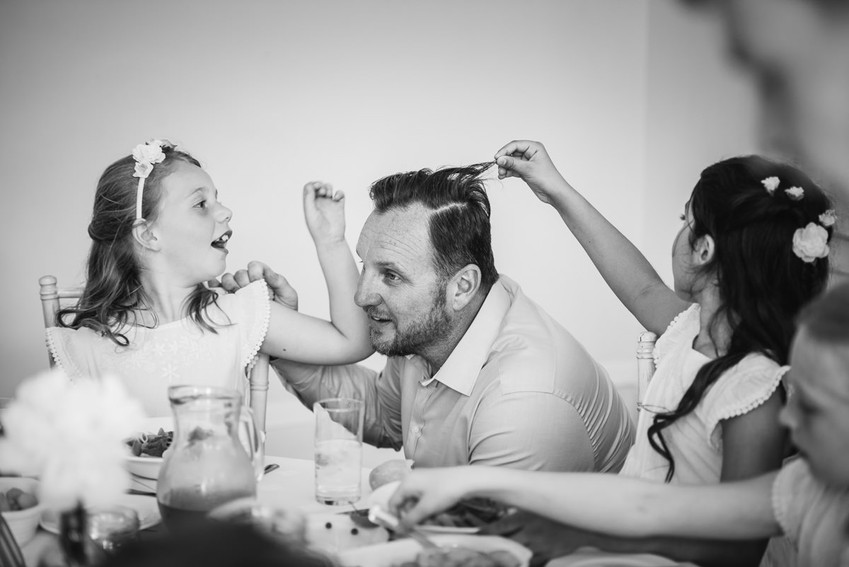 Bridesmaids and groom moment during wedding