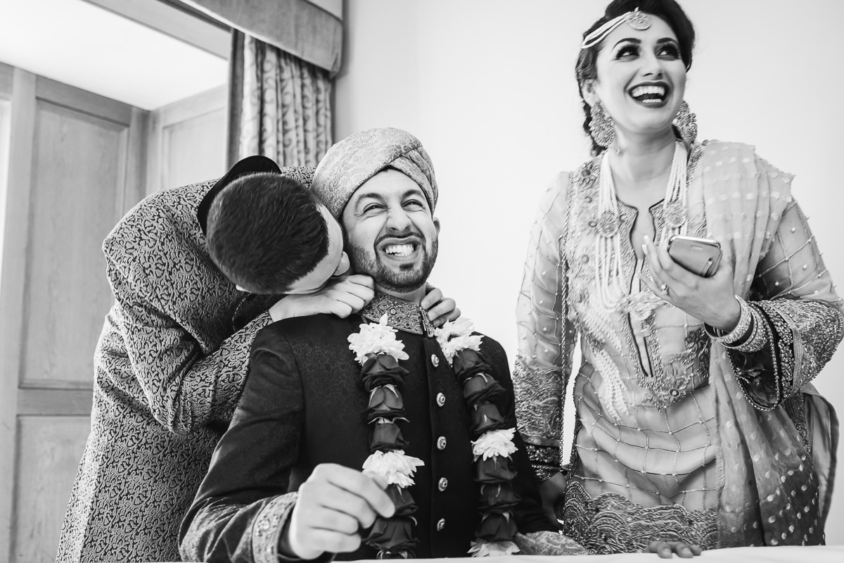 Asian wedding photography at Alton House Hotel - siblings playing