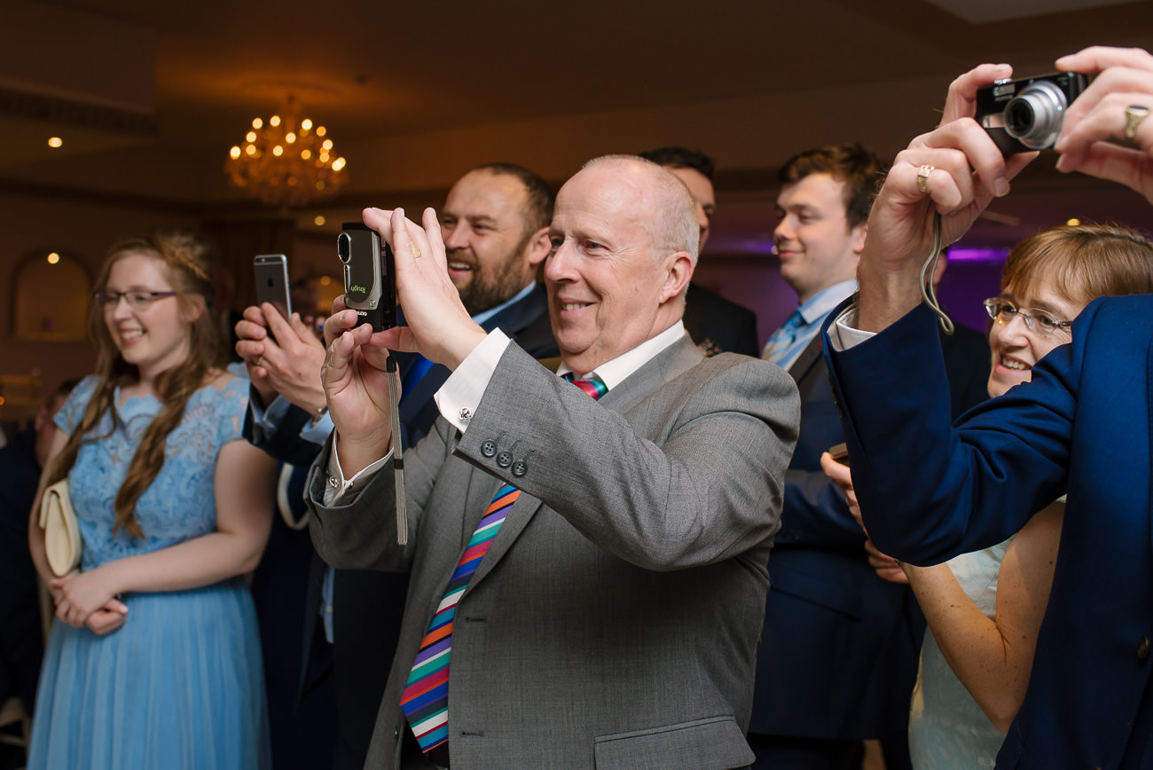 People photographing the young couple - first dance wedding photography at Froyle Park