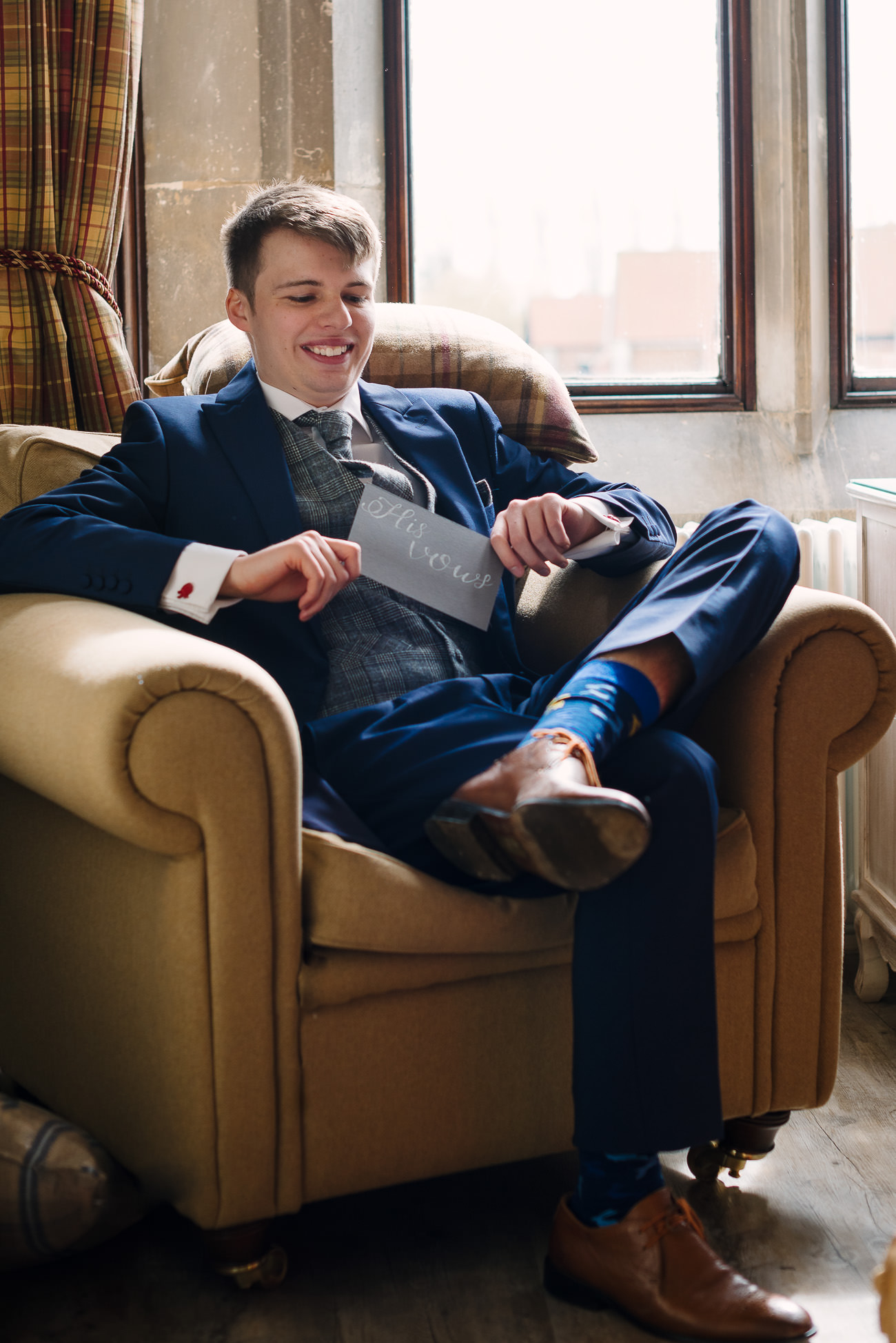 Groom getting ready for his wedding at Froyle Park