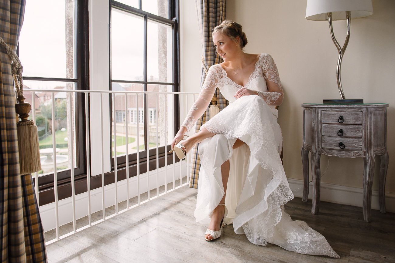 Bride getting ready for wedding at Froyle Park