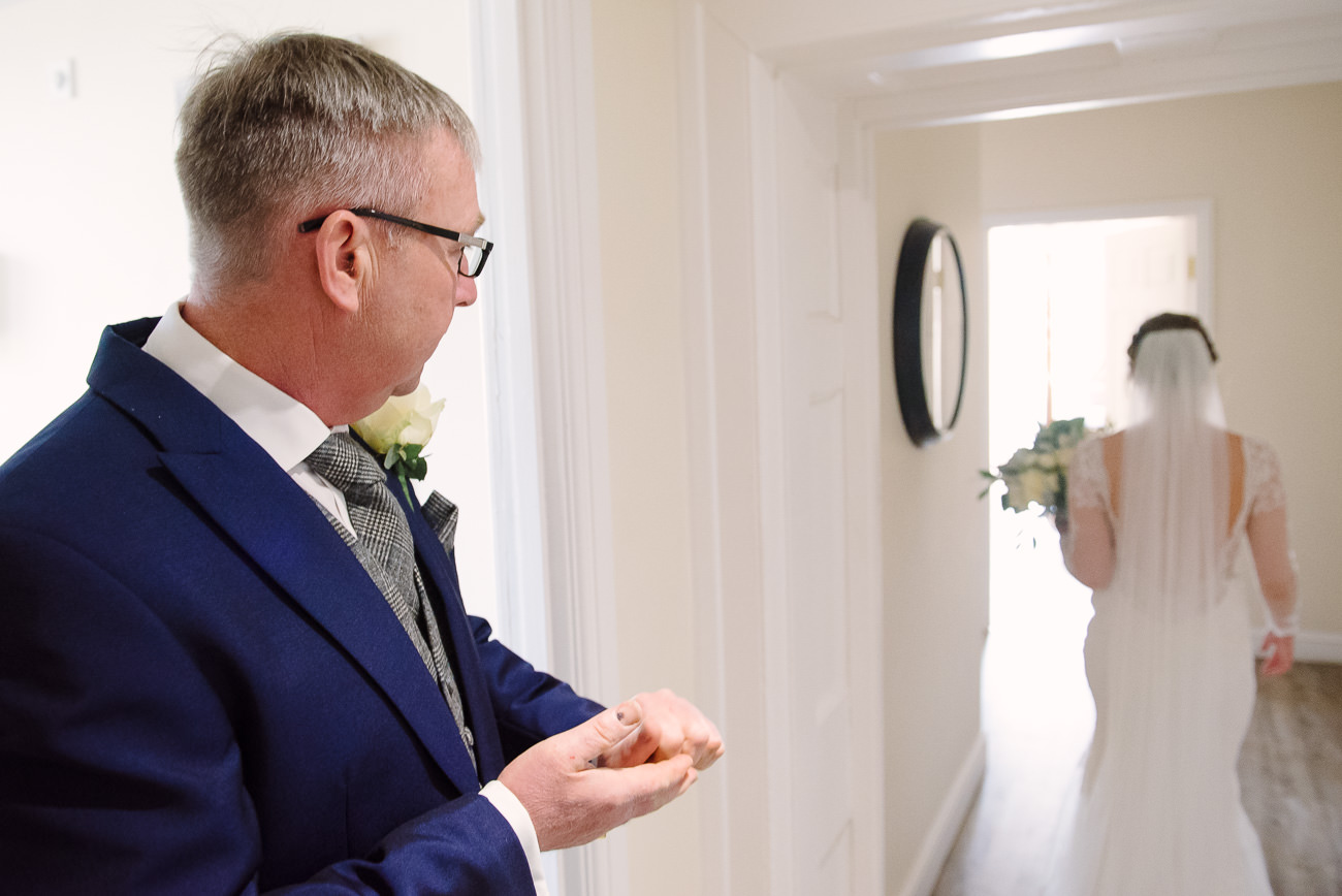 Father looks after his daughter leaving to the wedding ceremony at Froyle Park