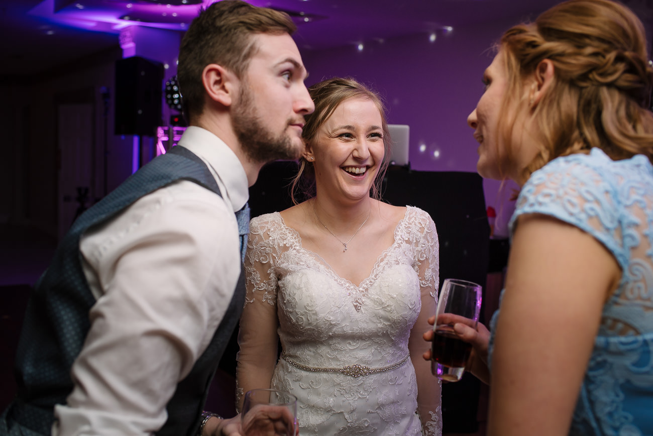 Bride having fun with friends at Froyle Park wedding