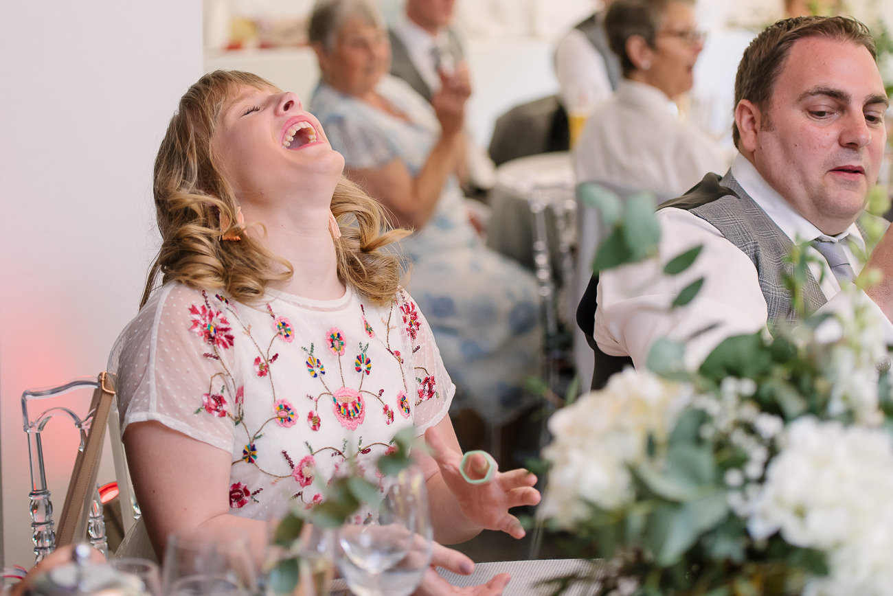 Wedding guest laughing and having good time at Russets Country House