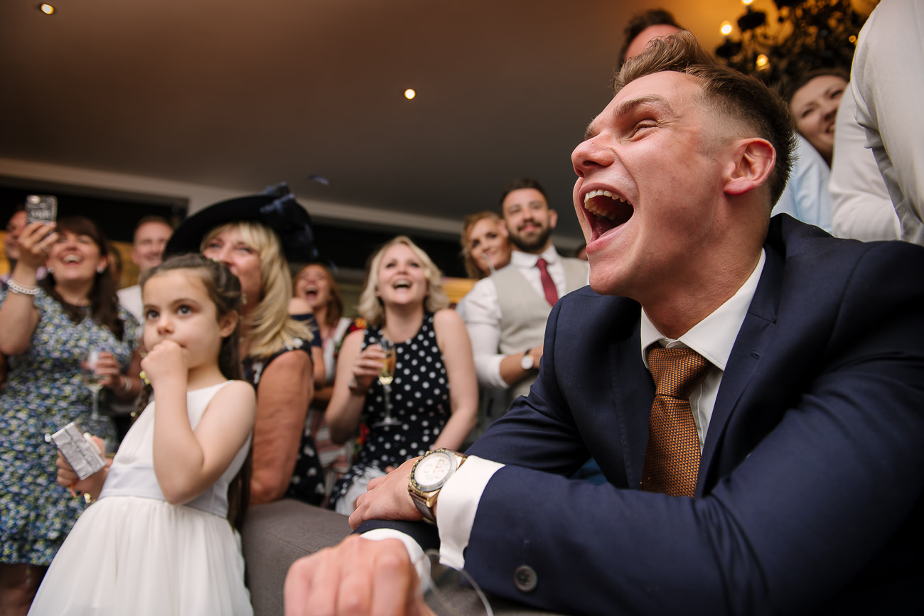 Guests cheerful watching a screen at Russets Country House