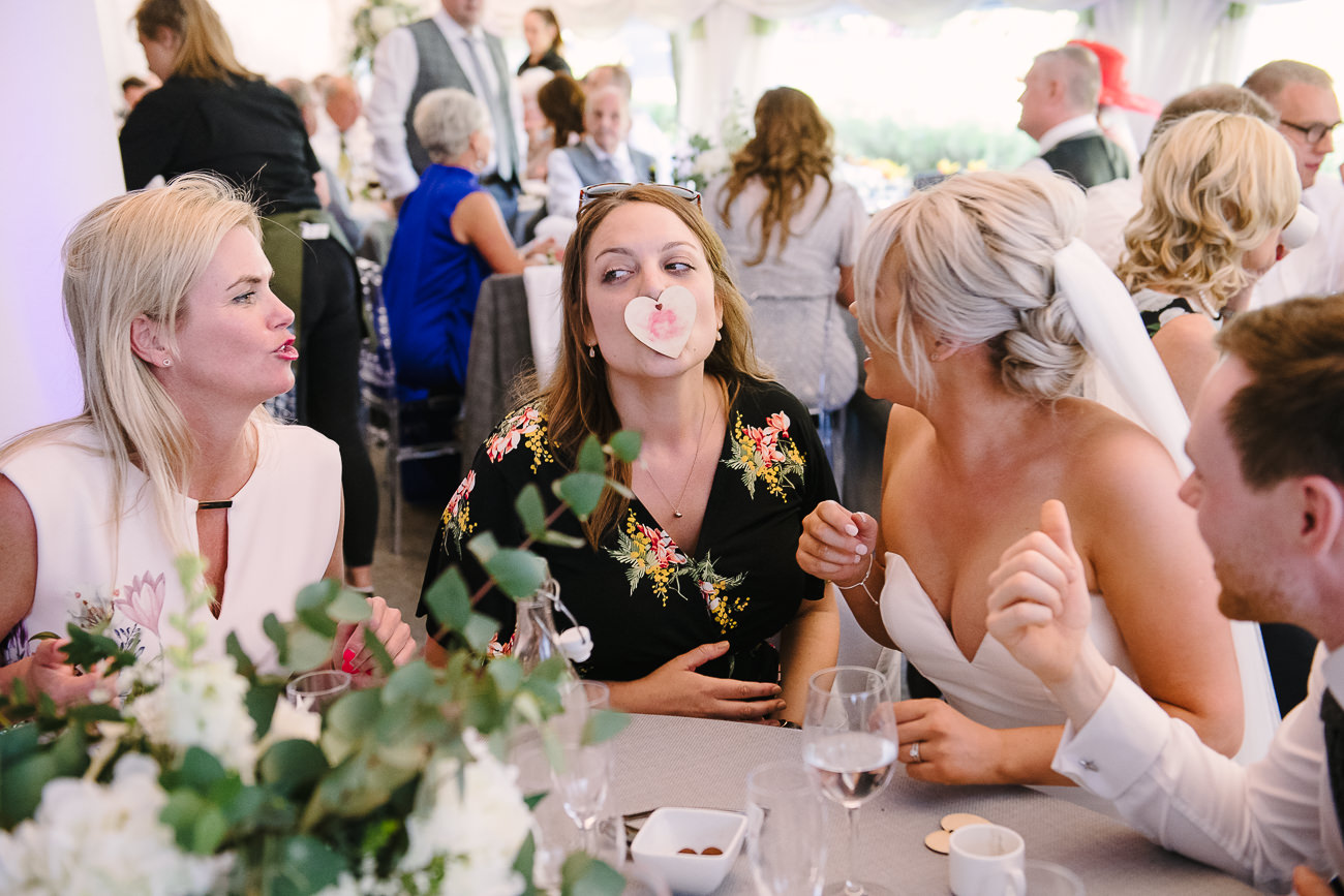 Girls playing games with wooden heart at a table in Russets Country House