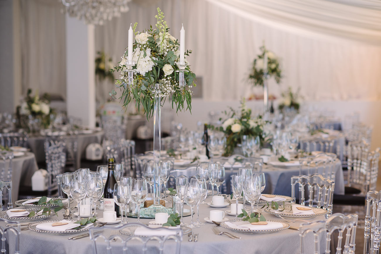 Table set up with white flowers and grey table cloth at Russets Country House