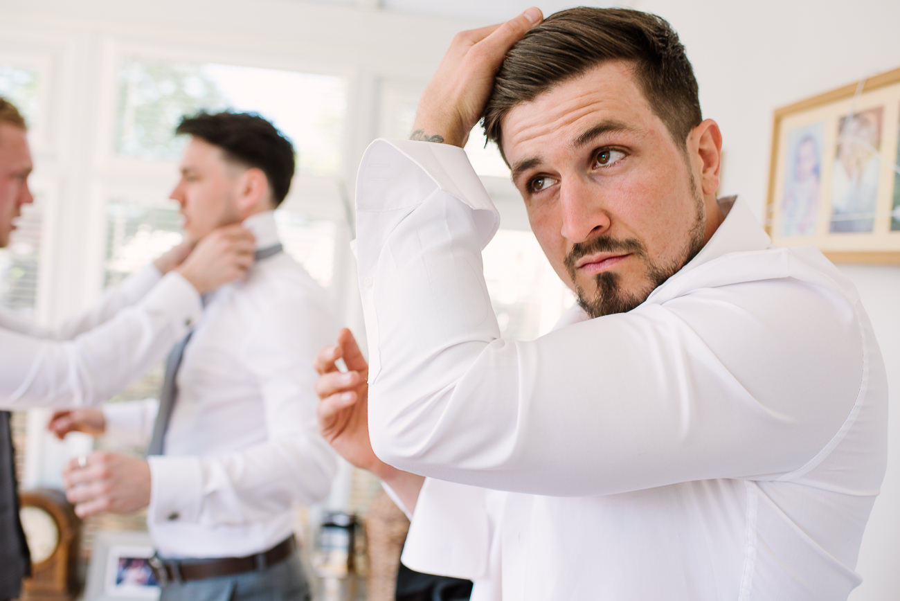 Groom doing his hairdo at Russets 