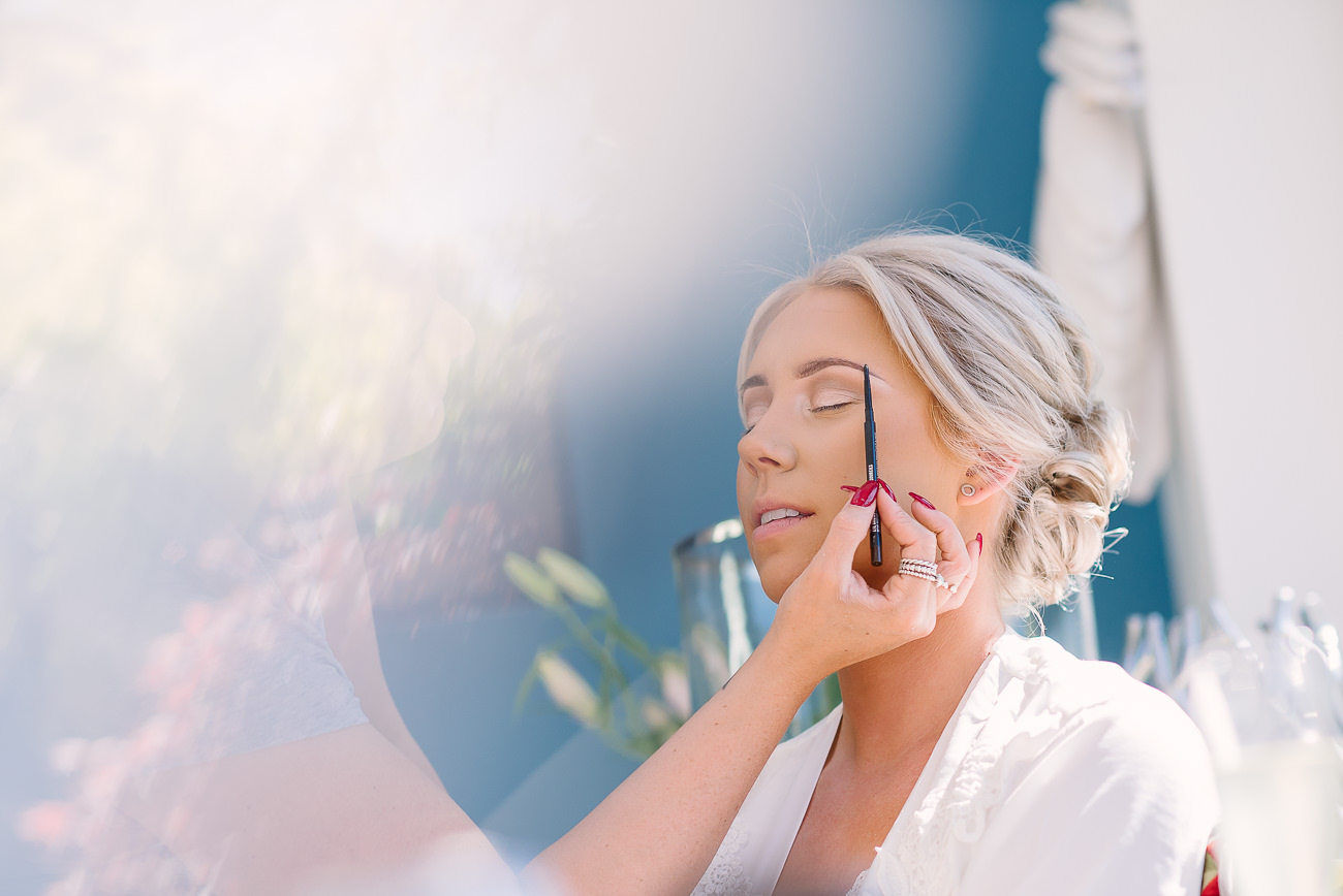 Bride having her make-up done at preps 